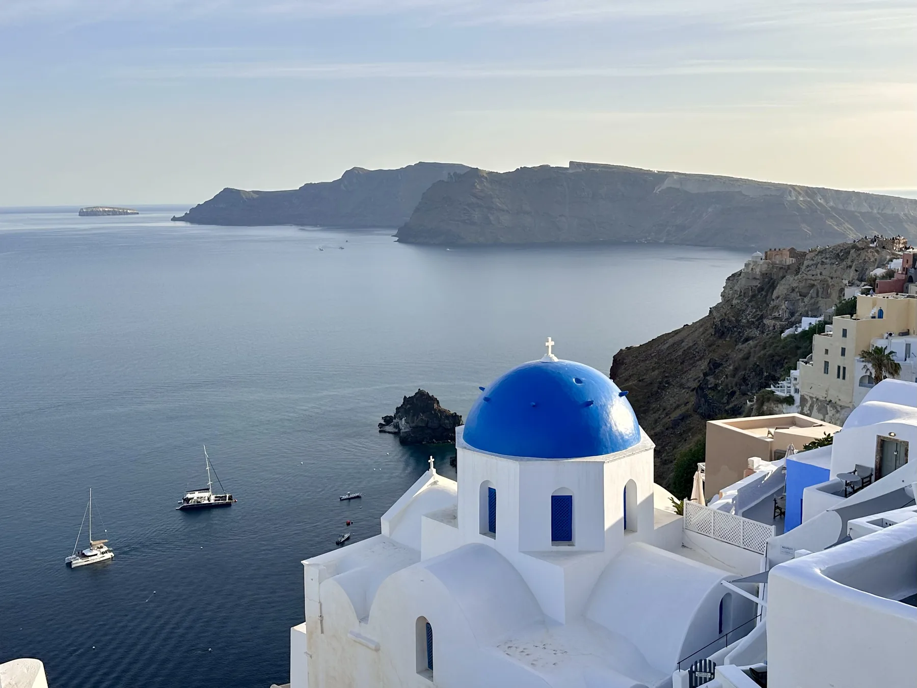 Blue-domed church overlooking the Aegean Sea in Santorini